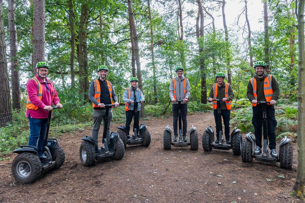 People lined up on segways