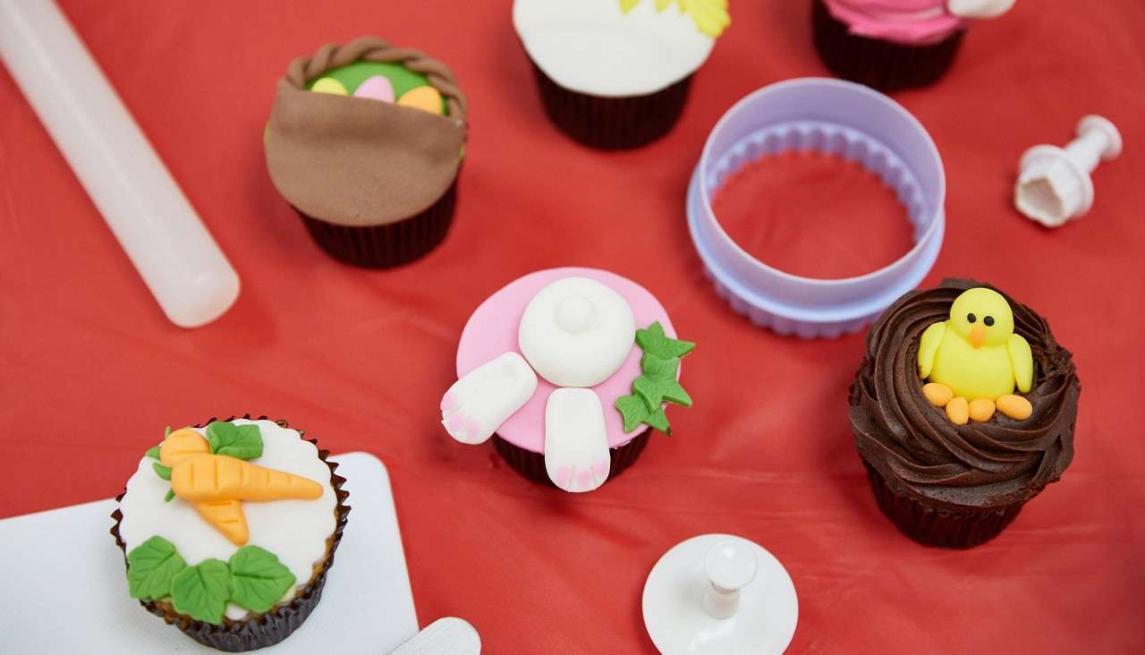 Cupcakes topped with Easter themed decorations.