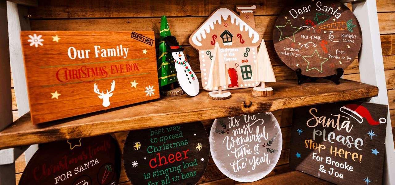 Decorative wood plaques with a Christmas theme.