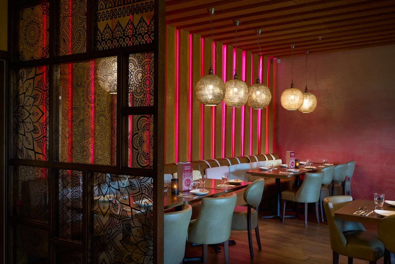 booths with tables laid. rajinda interior