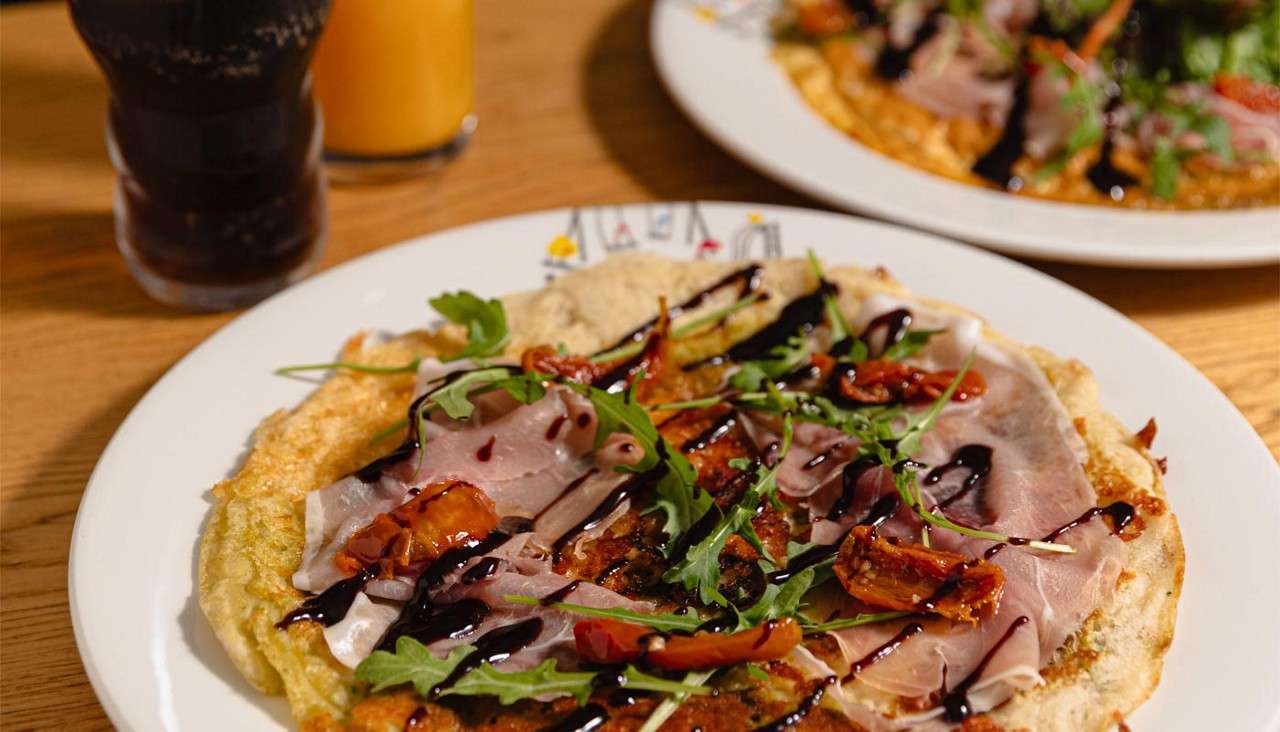 Omelette topped with cured Italian meats.