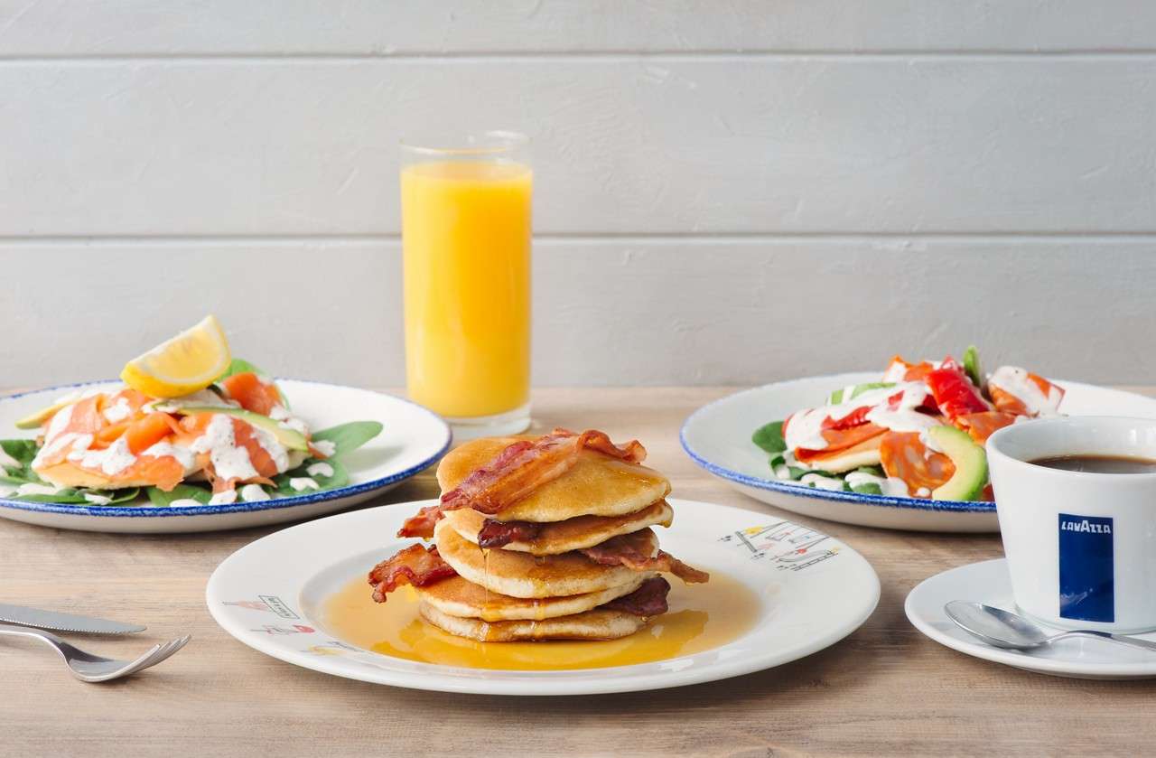 A selection of meals including salads and pancake stacks