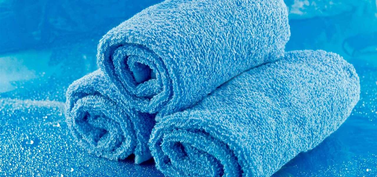 3 blue towels folded up
