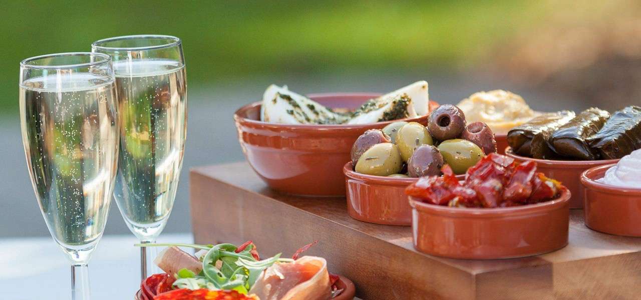 Tapas and Prosecco on a table in Vitale