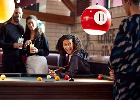 A family playing pool