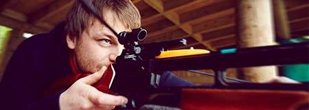 A man shooting a crossbow