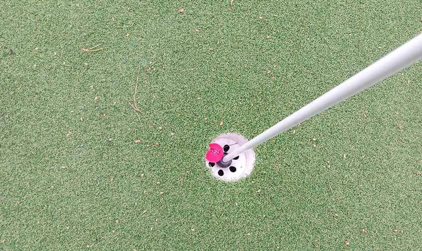 A golf ball in the hole