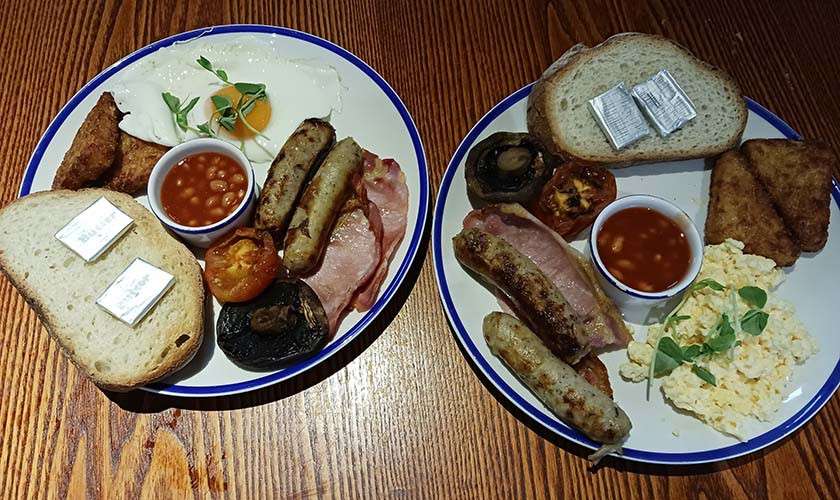 Two full english breakfasts on a table