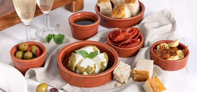 Antipasti platter with a selection of mini dishes.