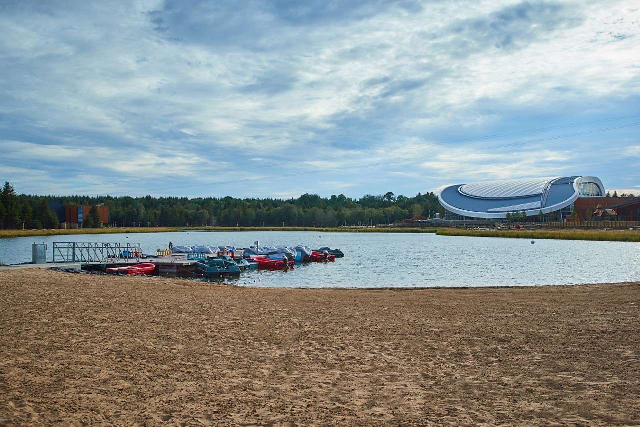 IRE lake with boats on the beach
