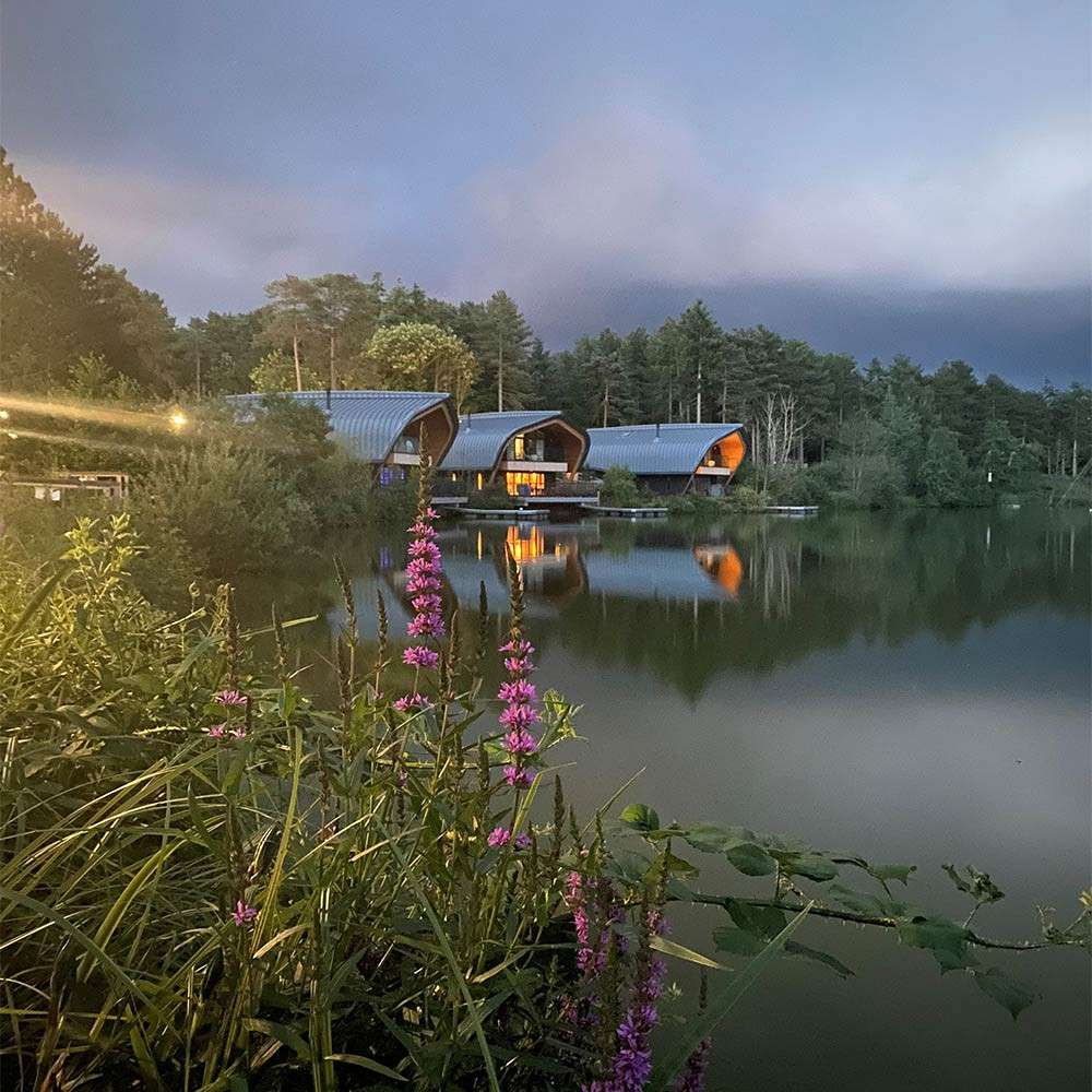 Waterside Lodges at Elveden Forest in the evening.