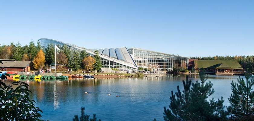 Exterior of Whinfell Plaza and Subtropical Swimming Paradise with lake in front of it