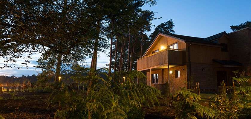 A lodge at sunset at Woburn Forest