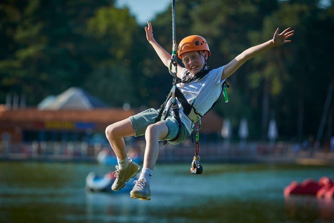 Girl aiming with a bow and arrow.