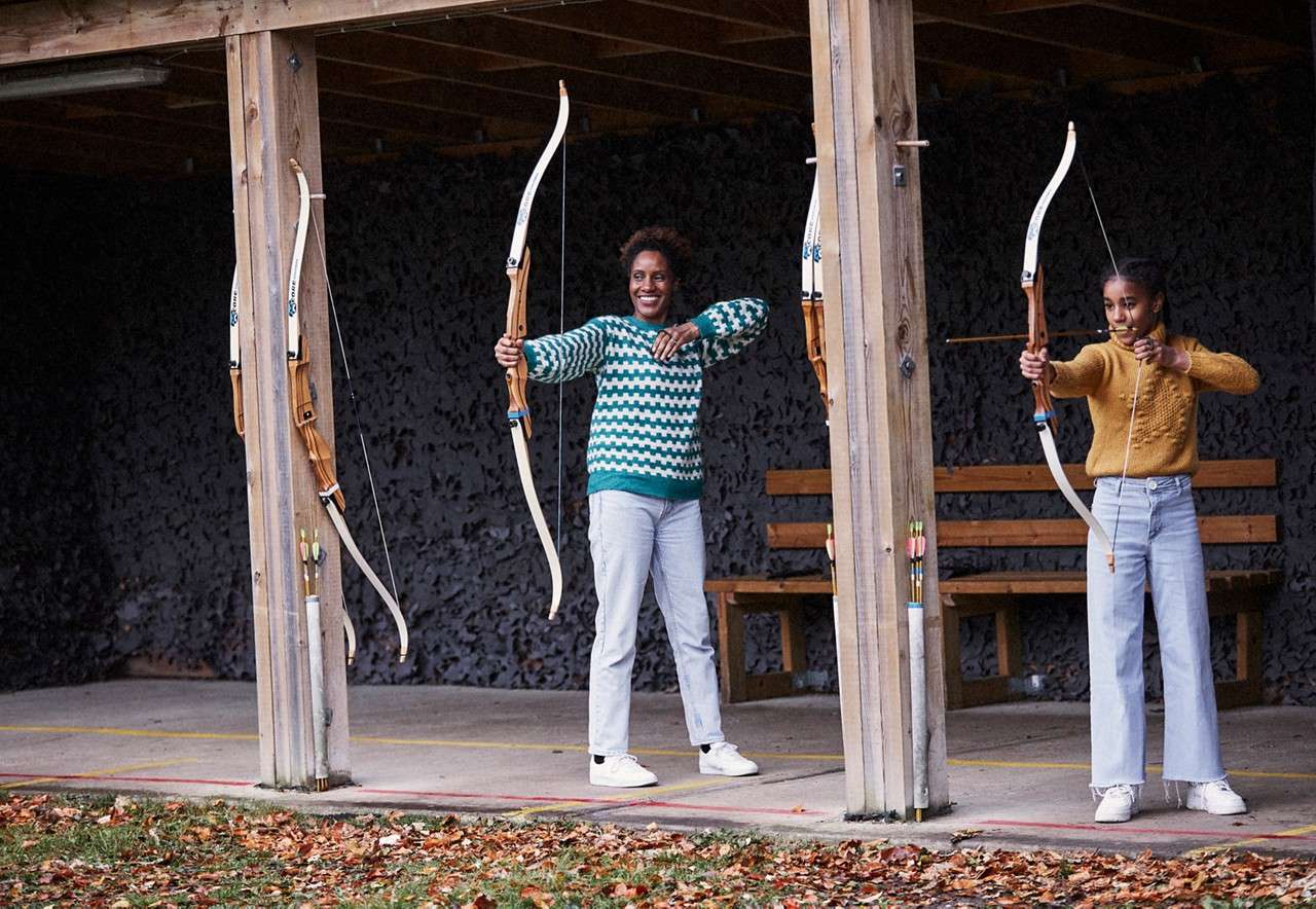 Two people aiming arrows in Target Archery.