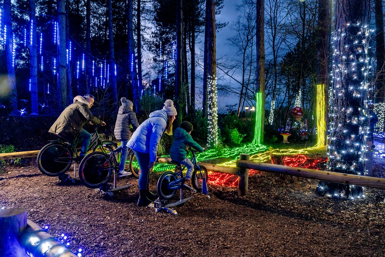 Family powering lights by cycling.