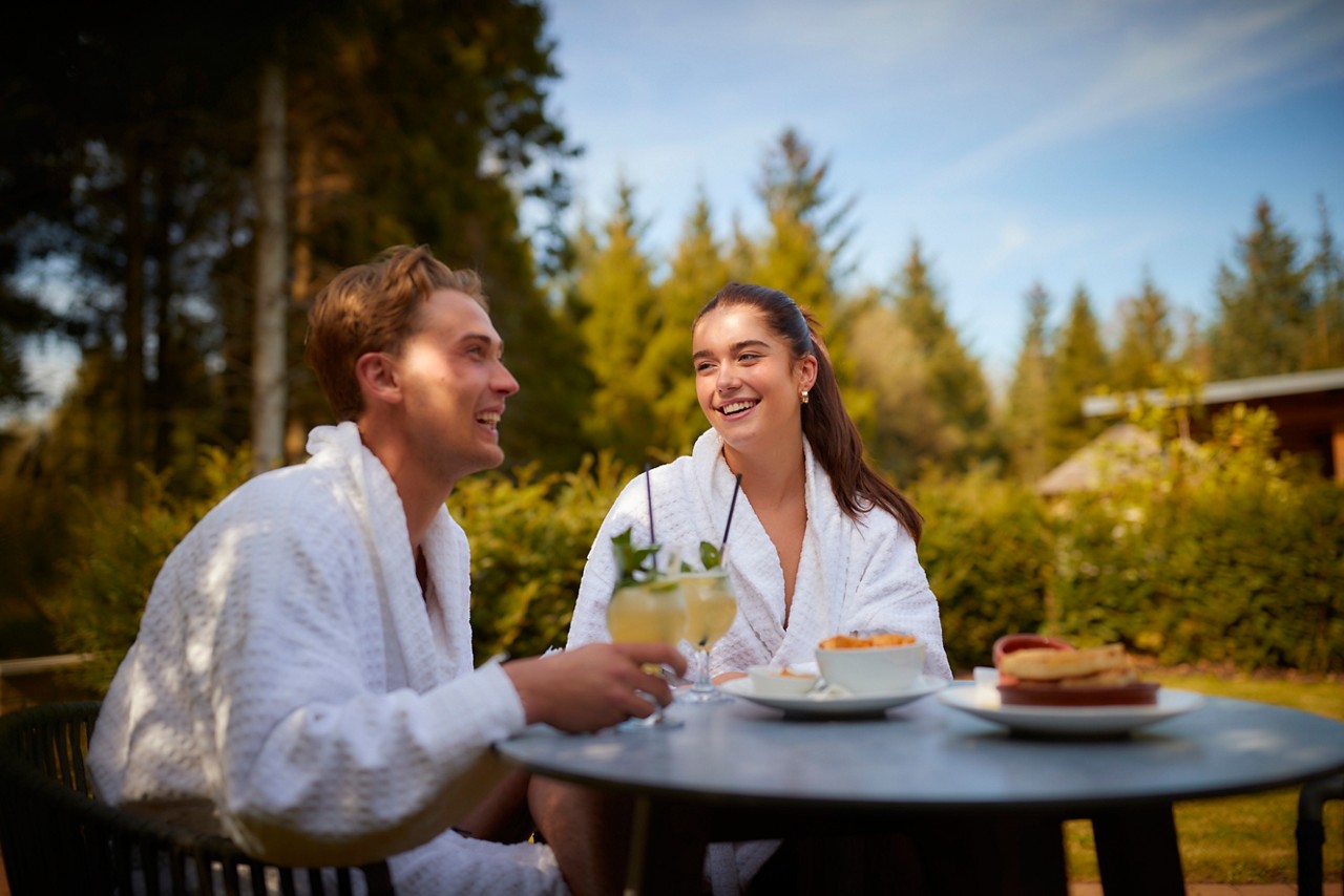 Couple sitting in the Vitalé Café Bar drinking champagne.
