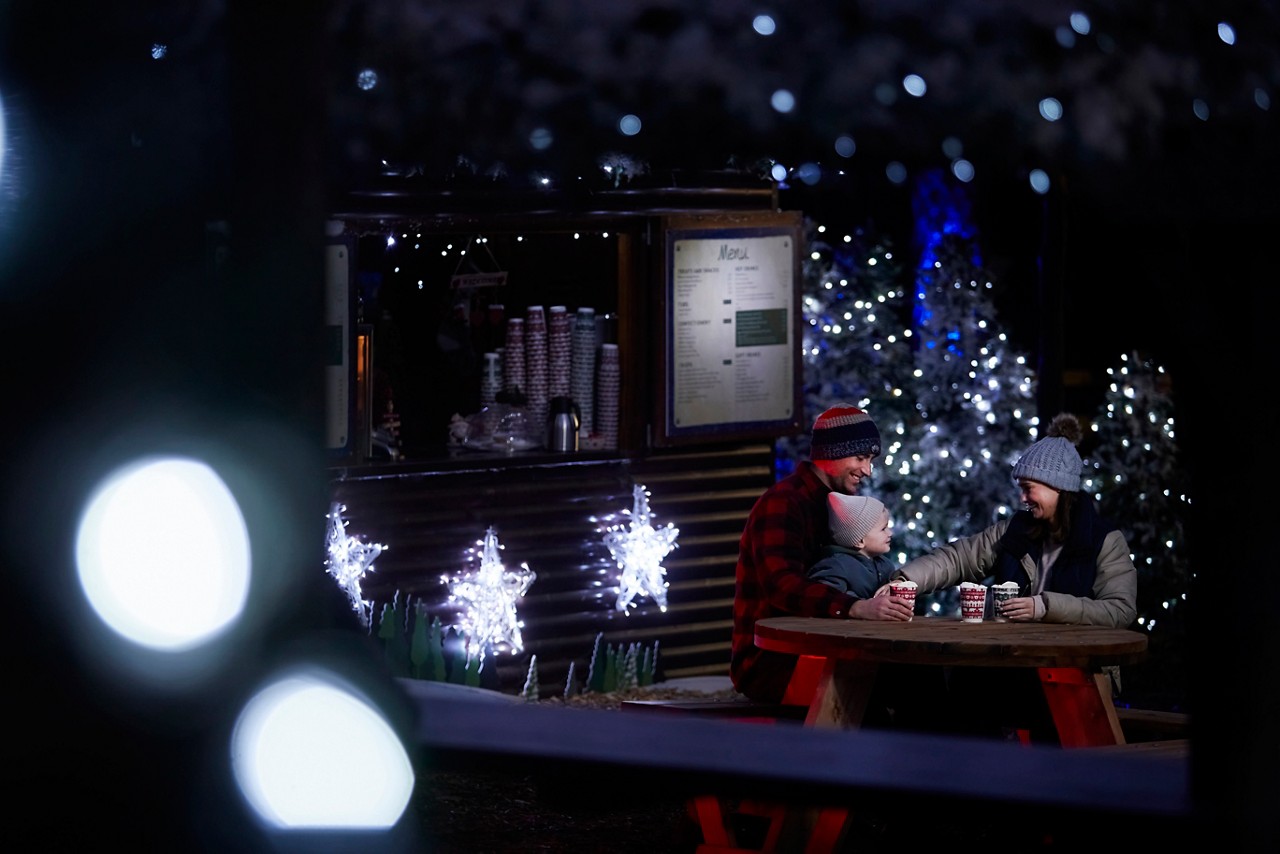 Wooden cabin serving festive food.