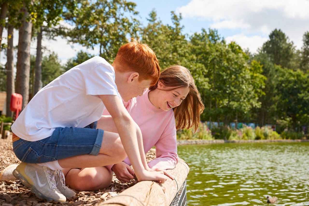 Brother and sister by the lake.