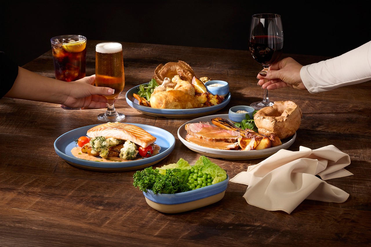 Selection of dises including Sunday Roast, seasonal vegatables and salmon on roasted vegetables.